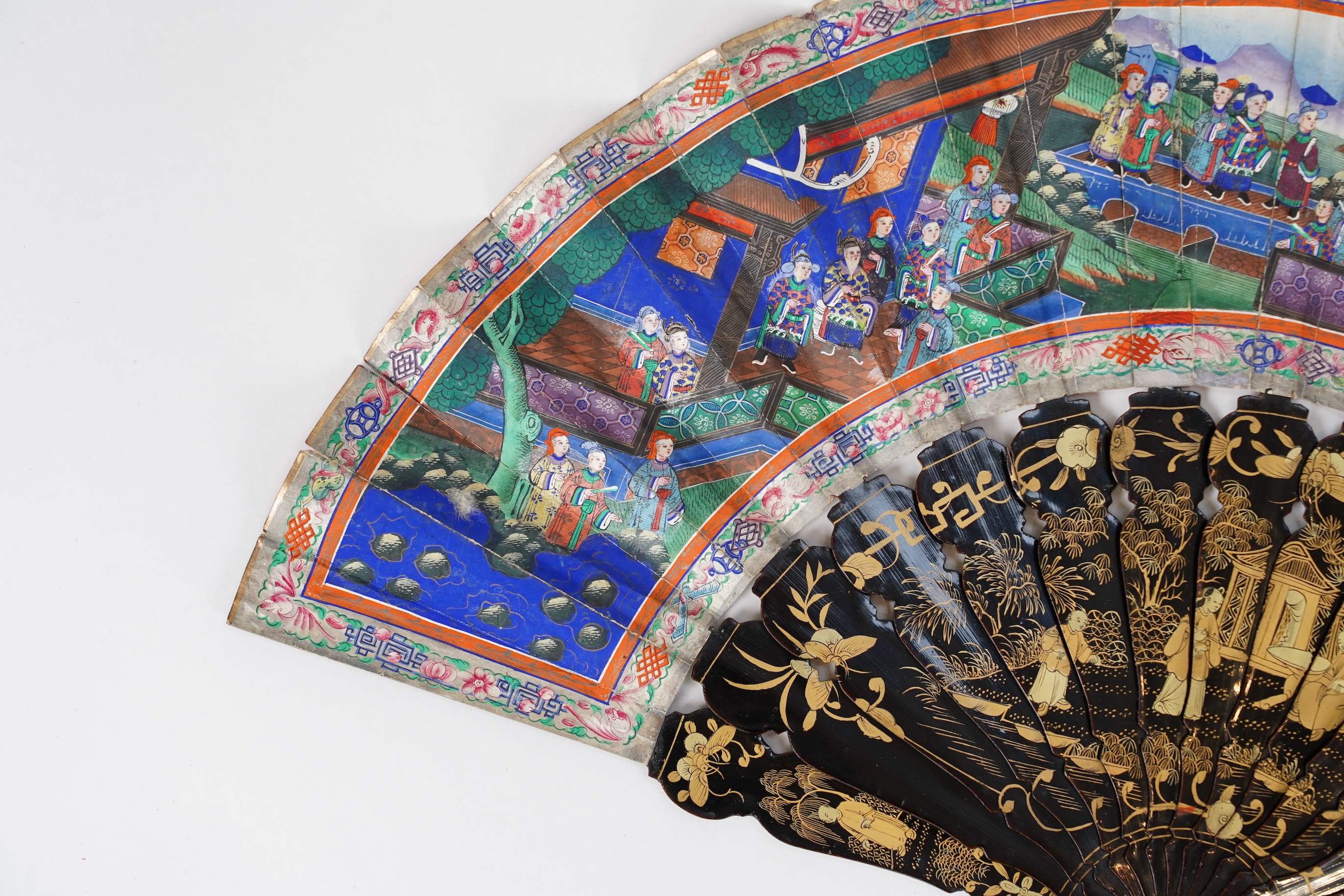 Three Chinese gilt-decorated black lacquer and painted leaf fans, 19th century